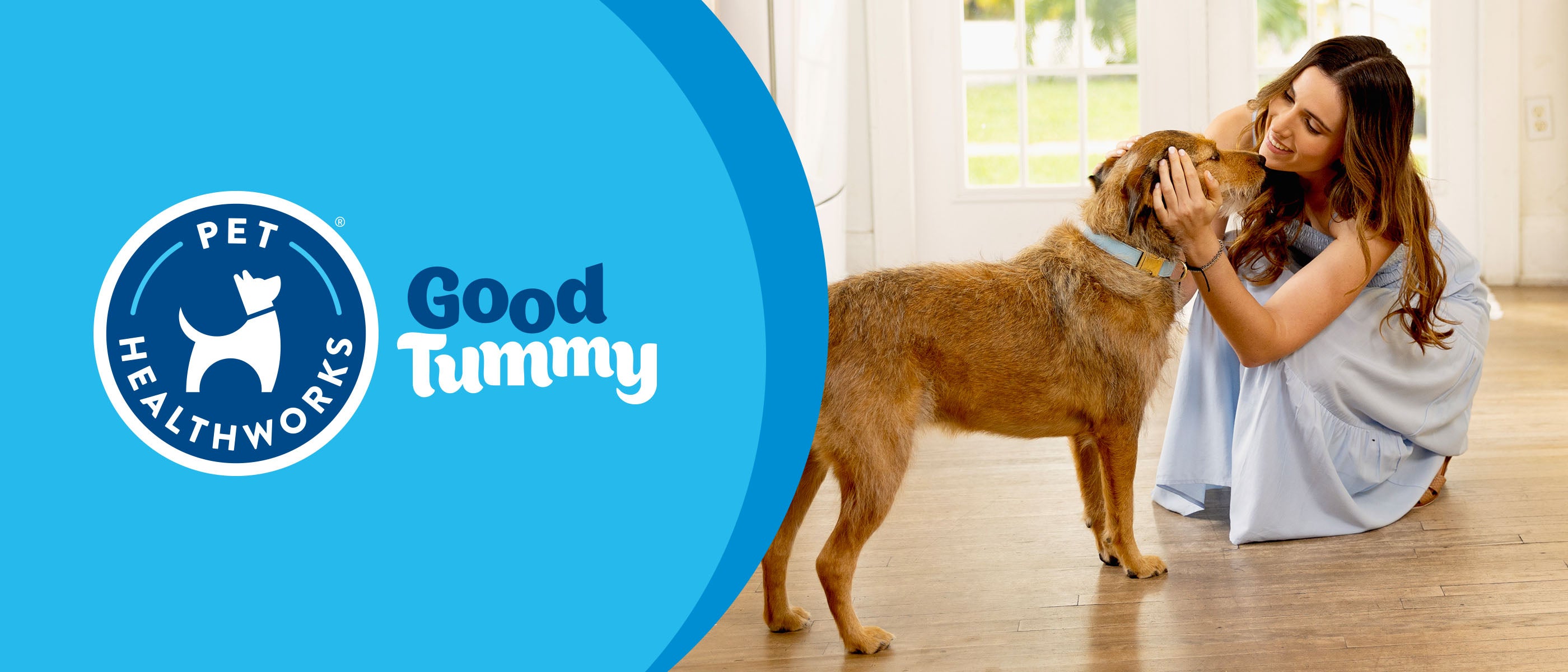 Woman petting a dog with Pet Healthworks Good Tummy logo on a blue background